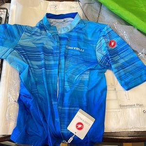 Castelli NWT bright blue riding top. Full zip. Brand new. Bike race. Peloton